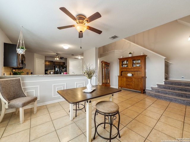 3842 Fiesta Trl, San Antonio, TX 78245 - dining room featuring ceiling fan, light tile patterned floors, stairway, and vaulted ceiling