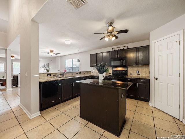3842 Fiesta Trl, San Antonio, TX 78245 - kitchen with black appliances, ceiling fan, backsplash, and light tile patterned flooring