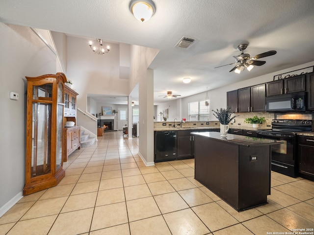 3842 Fiesta Trl, San Antonio, TX 78245 - kitchen featuring black appliances, ceiling fan, light tile patterned floors, and decorative backsplash