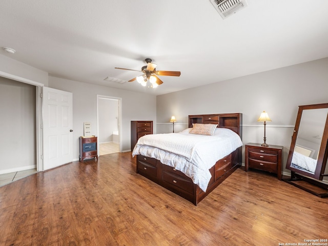 3842 Fiesta Trl, San Antonio, TX 78245 - bedroom with wood finished floors, a ceiling fan, and baseboards