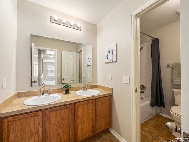 3842 Fiesta Trl, San Antonio, TX 78245 - bathroom with toilet, double vanity, shower / bath combo with shower curtain, and tile patterned floors