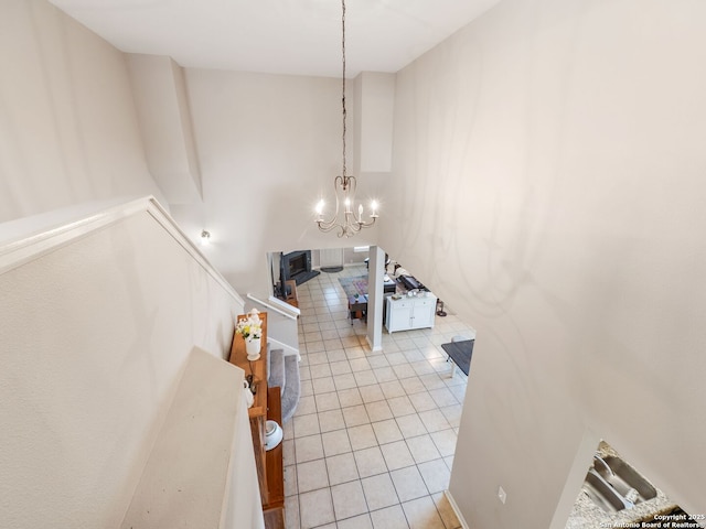 3842 Fiesta Trl, San Antonio, TX 78245 - foyer entrance with light tile patterned floors and a chandelier