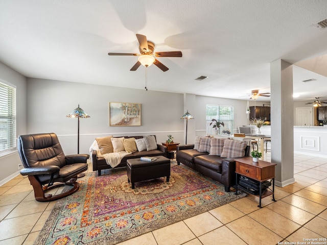 3842 Fiesta Trl, San Antonio, TX 78245 - living area with ceiling fan, light tile patterned flooring, and baseboards