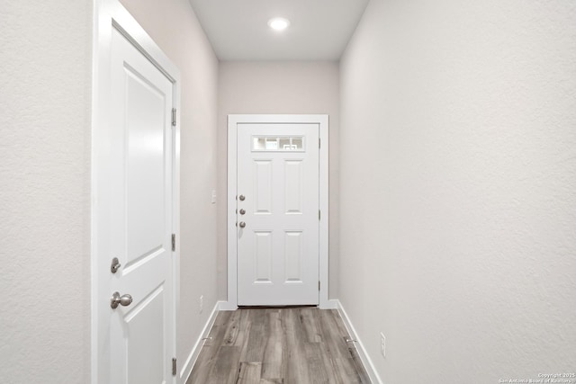21535 Sir Walter, San Antonio, TX 78256 - doorway with wood finished floors, baseboards, and recessed lighting