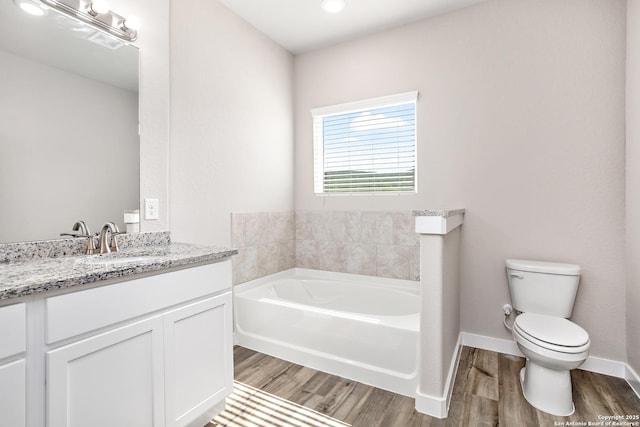 21535 Sir Walter, San Antonio, TX 78256 - full bath featuring a bath, wood finished floors, vanity, and toilet