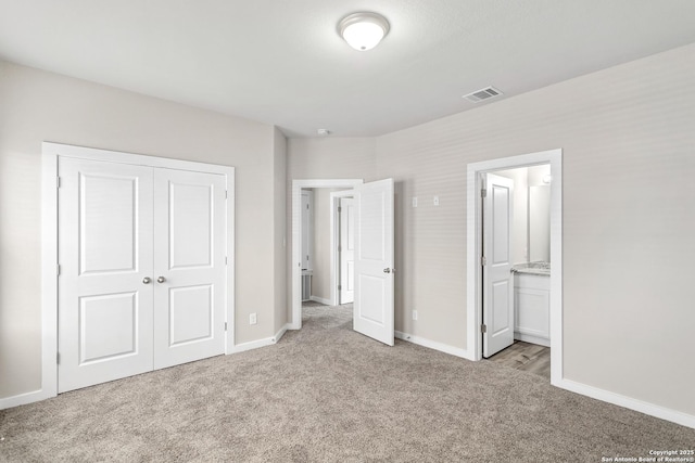 21535 Sir Walter, San Antonio, TX 78256 - unfurnished bedroom with carpet flooring, baseboards, a closet, and ensuite bathroom