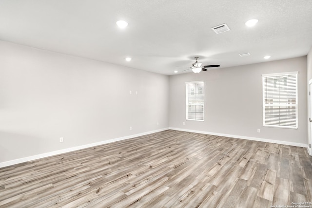 21535 Sir Walter, San Antonio, TX 78256 - spare room with a ceiling fan, recessed lighting, wood finished floors, plenty of natural light, and baseboards