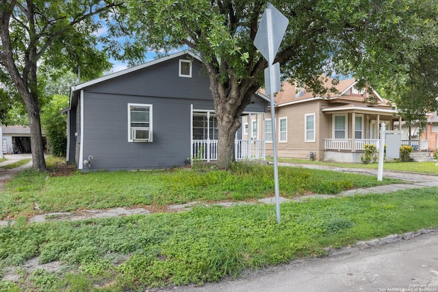 323 Roseborough, San Antonio, TX 78210 - bungalow-style home with a porch and a front yard