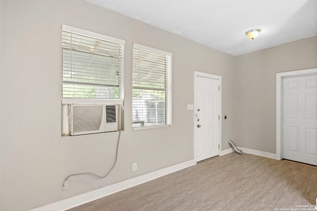323 Roseborough, San Antonio, TX 78210 - unfurnished room featuring baseboards, cooling unit, and light wood finished floors