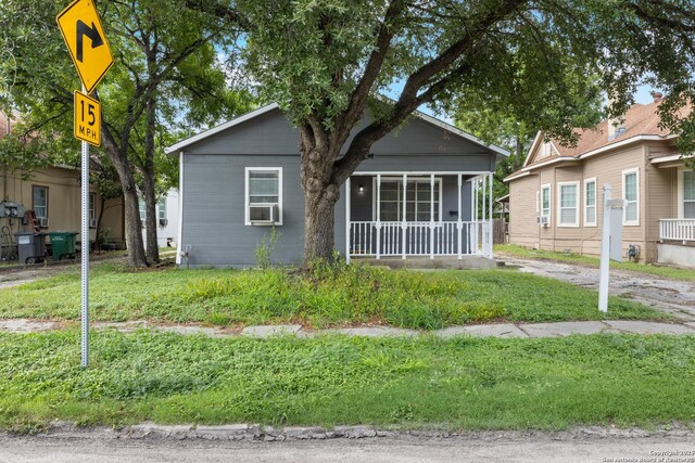 323 Roseborough, San Antonio, TX 78210 - view of front of home with a sunroom and cooling unit
