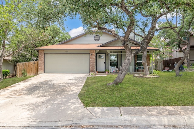 9711 Doefield, San Antonio, TX 78250 - view of front of property with a garage, driveway, a porch, and brick siding