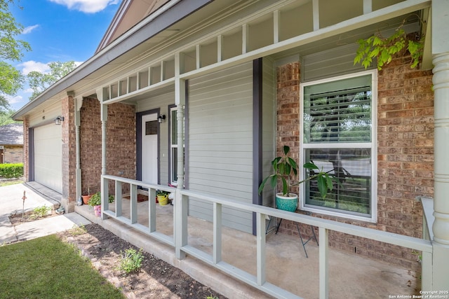 9711 Doefield, San Antonio, TX 78250 - view of property exterior with covered porch, brick siding, concrete driveway, and an attached garage