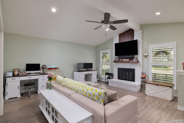 9711 Doefield, San Antonio, TX 78250 - living room featuring a desk, wood finished floors, ceiling fan, a brick fireplace, and recessed lighting