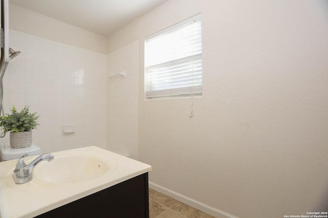 7 Brieley Ln, San Antonio, TX 78250 - full bathroom with baseboards, vanity, a shower, and tile patterned floors