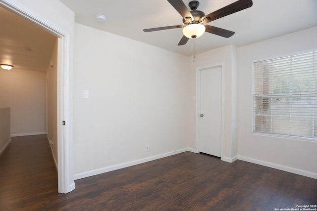 7 Brieley Ln, San Antonio, TX 78250 - unfurnished room featuring dark wood-style floors, ceiling fan, baseboards, and a smoke detector