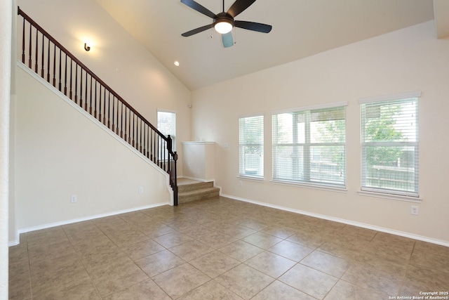 1415 Crane Ct, San Antonio, TX 78245 - spare room featuring stairway, ceiling fan, tile patterned floors, baseboards, and high vaulted ceiling