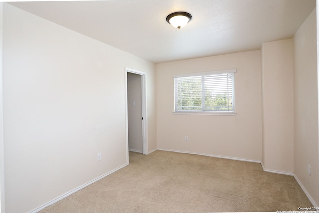 1415 Crane Ct, San Antonio, TX 78245 - unfurnished room with light carpet and baseboards
