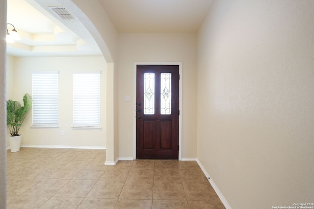 1415 Crane Ct, San Antonio, TX 78245 - foyer featuring arched walkways, light tile patterned floors, and baseboards