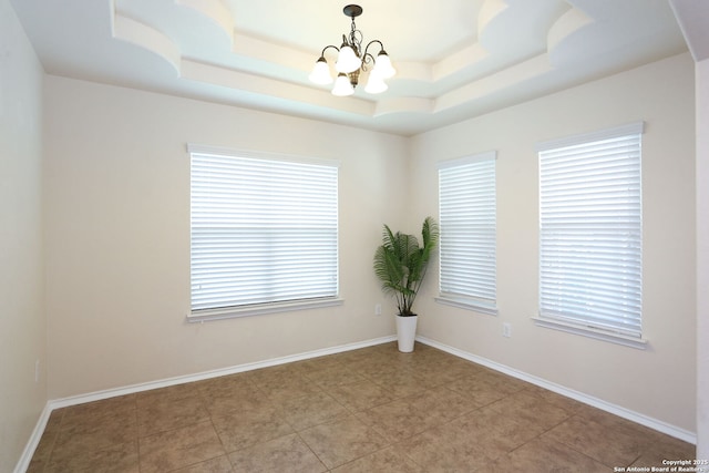 1415 Crane Ct, San Antonio, TX 78245 - empty room with a chandelier, healthy amount of natural light, a tray ceiling, and light tile patterned flooring