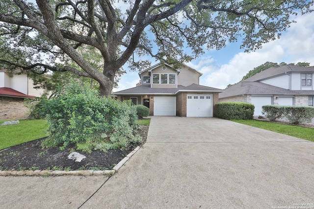 16415 Old Stable, San Antonio, TX 78247 - traditional home with concrete driveway, brick siding, an attached garage, roof with shingles, and a front yard