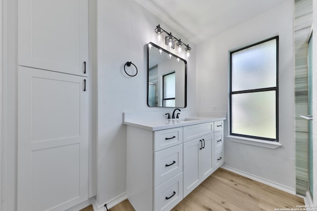 16415 Old Stable, San Antonio, TX 78247 - bathroom with vanity, wood finished floors, and baseboards
