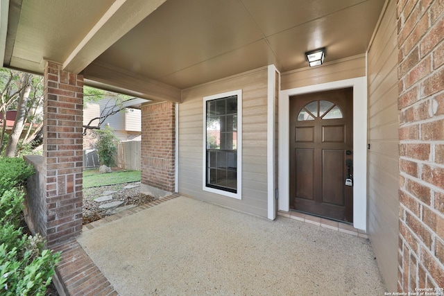 16415 Old Stable, San Antonio, TX 78247 - entrance to property featuring brick siding, a porch, and cooling unit