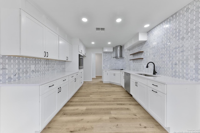16415 Old Stable, San Antonio, TX 78247 - kitchen featuring wall chimney range hood, a sink, appliances with stainless steel finishes, open shelves, and light countertops