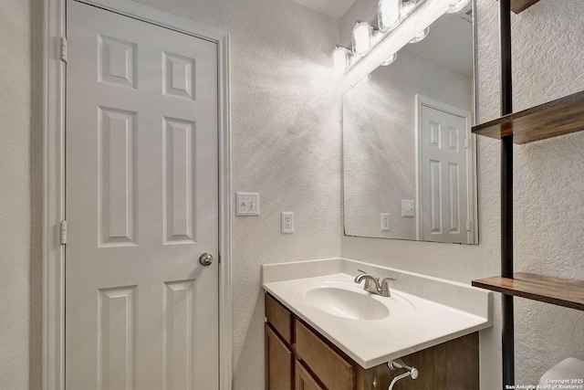 11907 Pure Silver, San Antonio, TX 78254 - bathroom with a textured wall and vanity