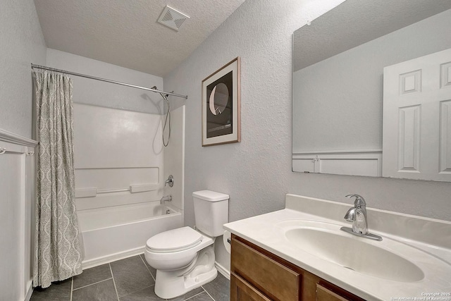 11907 Pure Silver, San Antonio, TX 78254 - bathroom featuring a textured ceiling, shower / bath combo, vanity, toilet, and tile patterned flooring