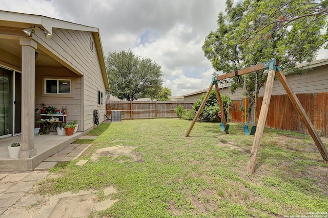 11907 Pure Silver, San Antonio, TX 78254 - view of yard with a playground, a patio, and cooling unit