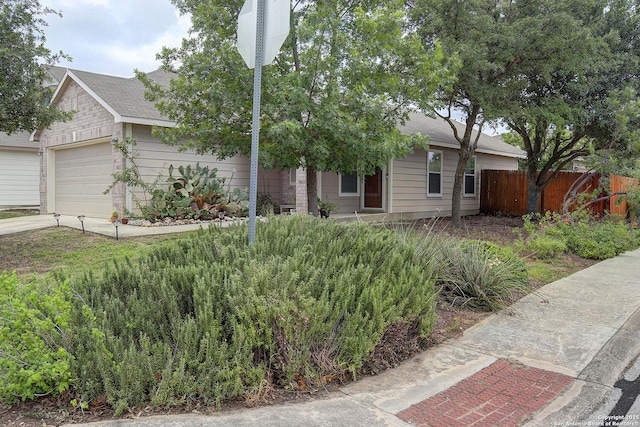 11907 Pure Silver, San Antonio, TX 78254 - view of front of house with an attached garage, roof with shingles, and driveway