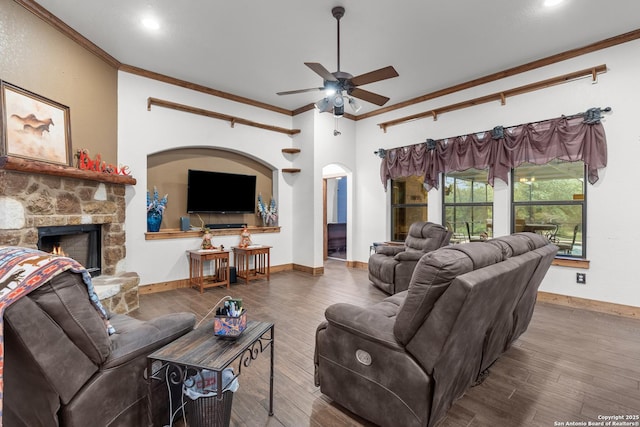 151 Native Pecan, Canyon Lake, TX 78133 - living area featuring crown molding, a ceiling fan, a fireplace, wood finished floors, and baseboards