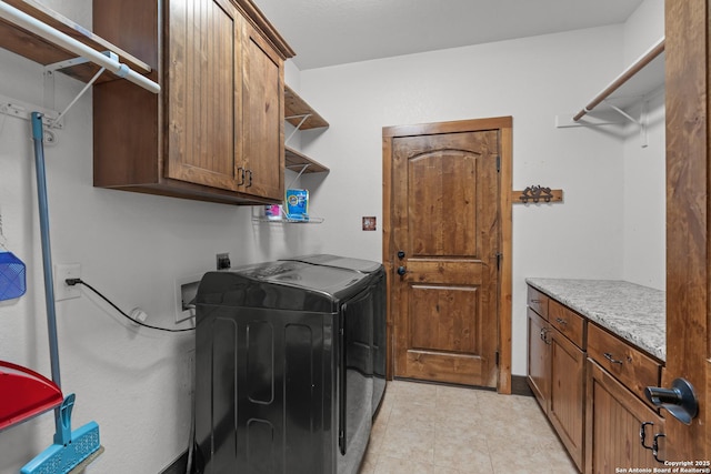 151 Native Pecan, Canyon Lake, TX 78133 - washroom with cabinet space, washer and dryer, and light tile patterned floors