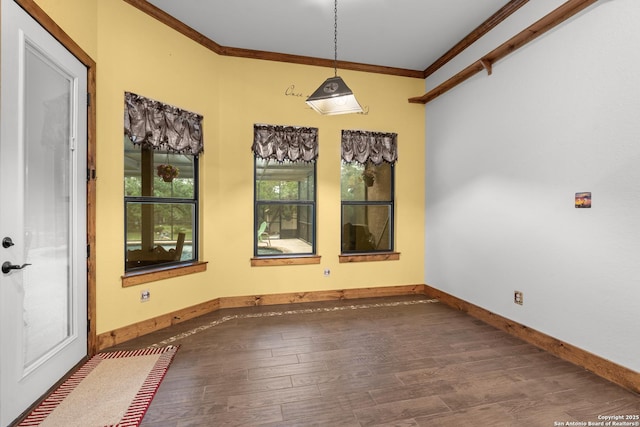 151 Native Pecan, Canyon Lake, TX 78133 - unfurnished dining area featuring crown molding, wood finished floors, and baseboards