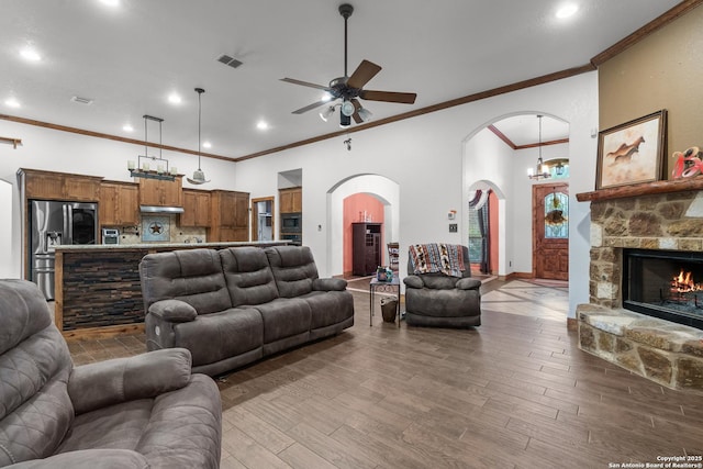 151 Native Pecan, Canyon Lake, TX 78133 - living area featuring ceiling fan, arched walkways, ornamental molding, wood finished floors, and recessed lighting