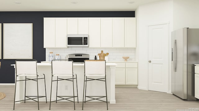 10830 Siebern Rd, San Antonio, TX 78224 - kitchen with fridge with ice dispenser, light wood finished floors, and white cabinetry