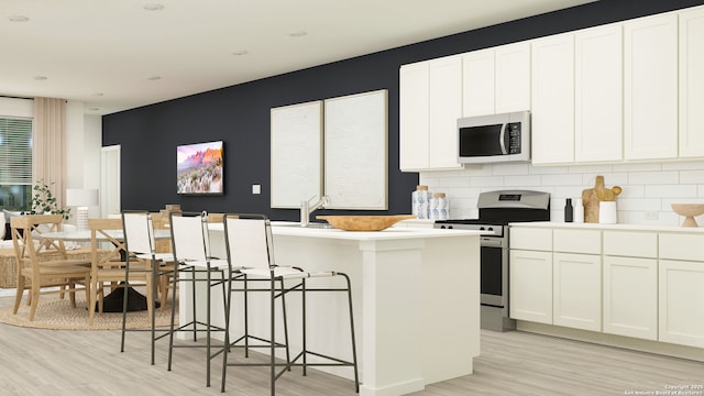 10830 Siebern Rd, San Antonio, TX 78224 - kitchen with gas stove, light wood finished floors, and white cabinets