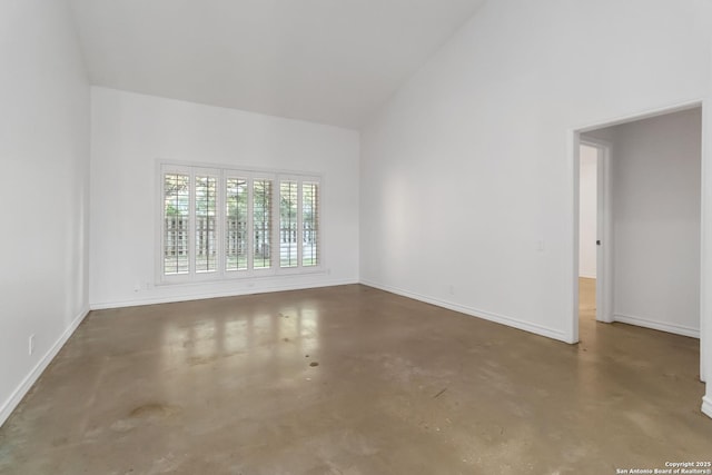 942 Lightstone, San Antonio, TX 78258 - spare room with concrete floors, high vaulted ceiling, and baseboards
