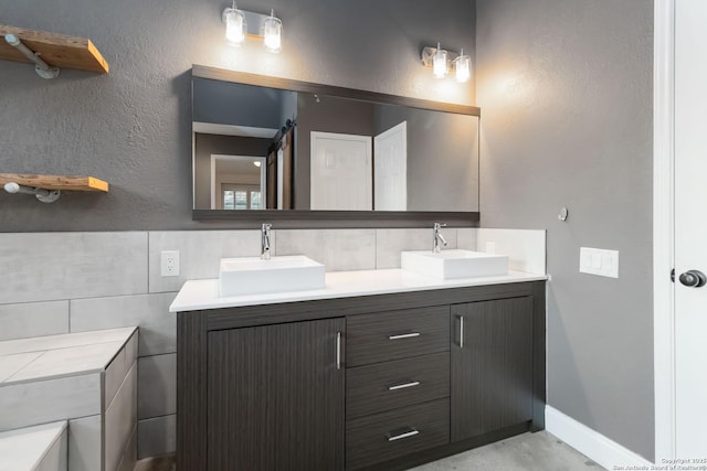 942 Lightstone, San Antonio, TX 78258 - full bathroom with double vanity and tile walls