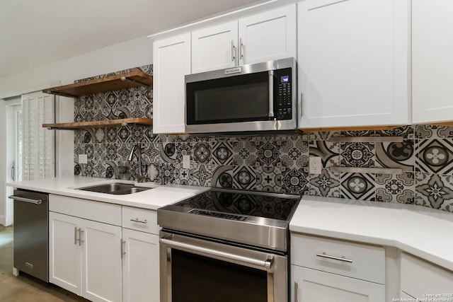 942 Lightstone, San Antonio, TX 78258 - kitchen with appliances with stainless steel finishes, a sink, open shelves, and light countertops