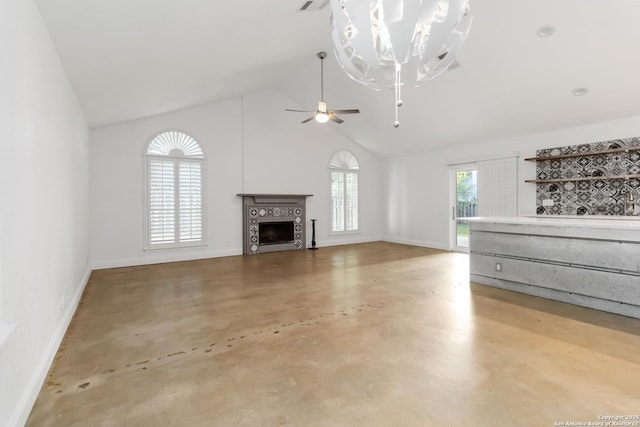 942 Lightstone, San Antonio, TX 78258 - unfurnished living room with finished concrete flooring, high vaulted ceiling, baseboards, a fireplace, and a ceiling fan
