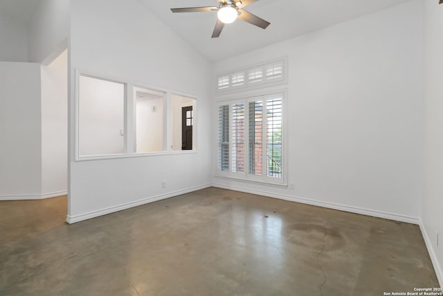 942 Lightstone, San Antonio, TX 78258 - spare room with finished concrete flooring, ceiling fan, baseboards, and high vaulted ceiling
