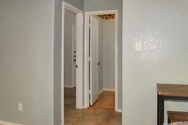 7527 Escada Crst, San Antonio, TX 78254 - hallway with light tile patterned floors and baseboards
