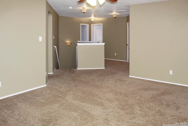 7527 Escada Crst, San Antonio, TX 78254 - spare room featuring carpet flooring, ceiling fan, and baseboards