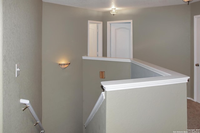 7527 Escada Crst, San Antonio, TX 78254 - hallway featuring an upstairs landing and carpet flooring
