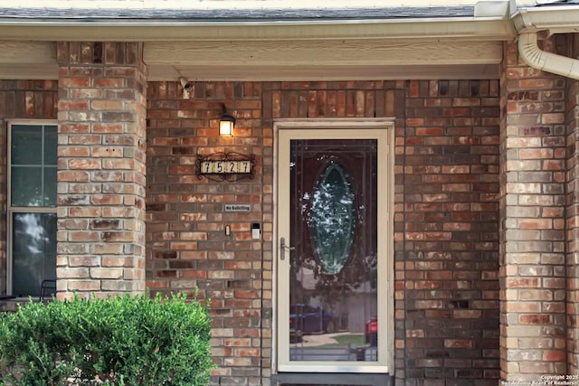 7527 Escada Crst, San Antonio, TX 78254 - property entrance with brick siding and a shingled roof