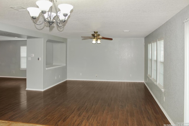 7527 Escada Crst, San Antonio, TX 78254 - unfurnished room with a chandelier, a textured ceiling, dark wood-type flooring, ceiling fan, and baseboards
