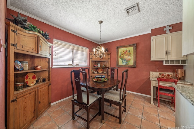 11 El Norte Cir, Uvalde, TX 78801 - dining area with a textured ceiling, crown molding, a chandelier, light tile patterned floors, and baseboards