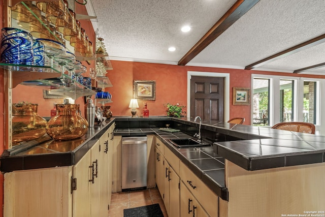 11 El Norte Cir, Uvalde, TX 78801 - bar with stainless steel dishwasher, a textured ceiling, a sink, light tile patterned flooring, and recessed lighting