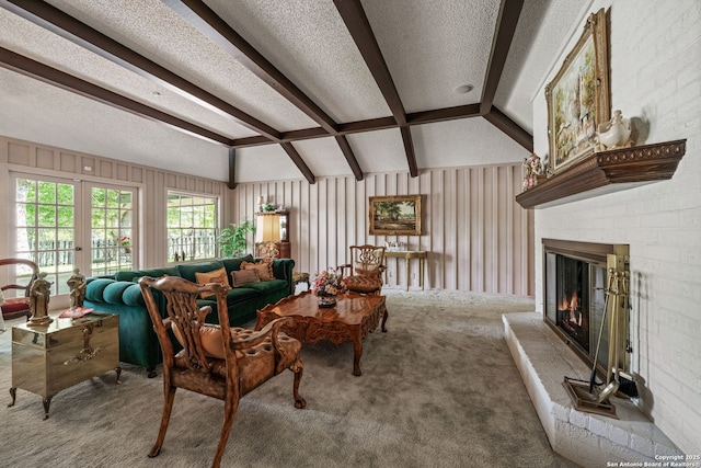 11 El Norte Cir, Uvalde, TX 78801 - living area featuring a textured ceiling, carpet, and a fireplace